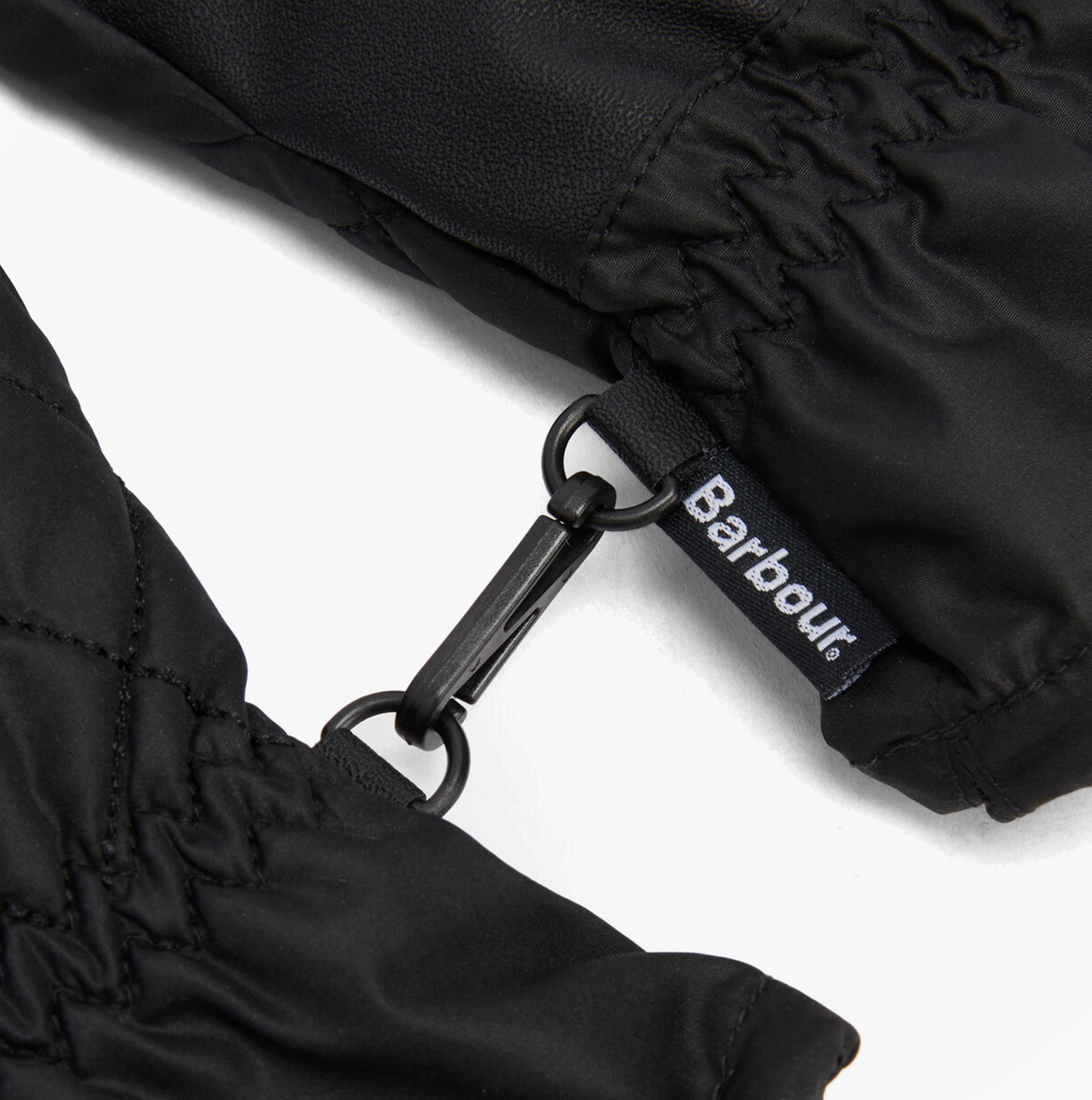 Detail view of Barbour JONI WATERPROOF Womens Touchscreen Gloves Black showcasing the woven side flag label.