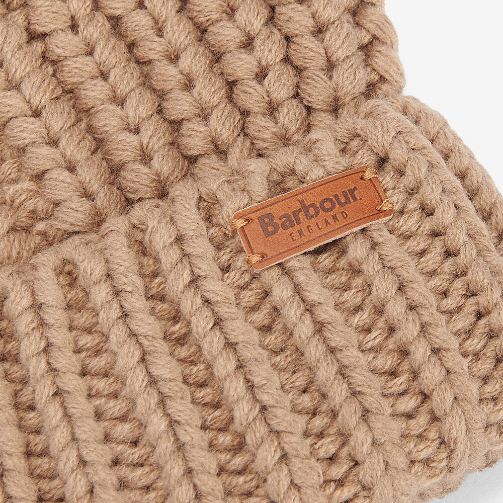 Barbour SALTBURN Womens Pom-Pom Beanie Mink detail view of chunky-knit structure with logo-embossed leather badge.