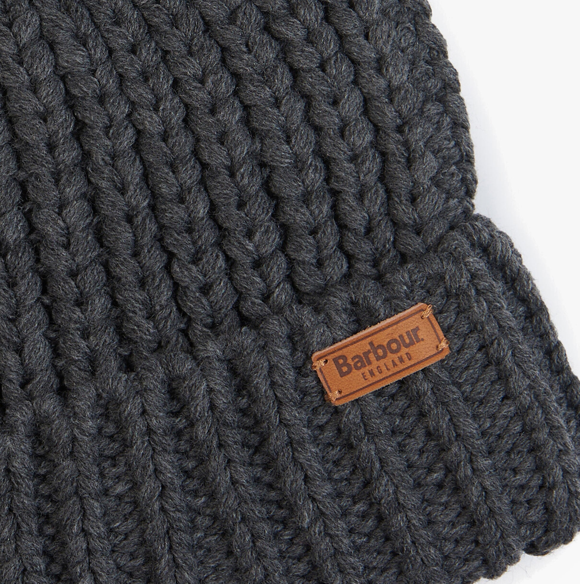 Detail view of Barbour SALTBURN Womens Beanie Charcoal showcasing knit texture and brand tag.
