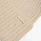 Barbour MERYL Womens Beanie Heritage Cream detail view showing soft knit texture and logo.