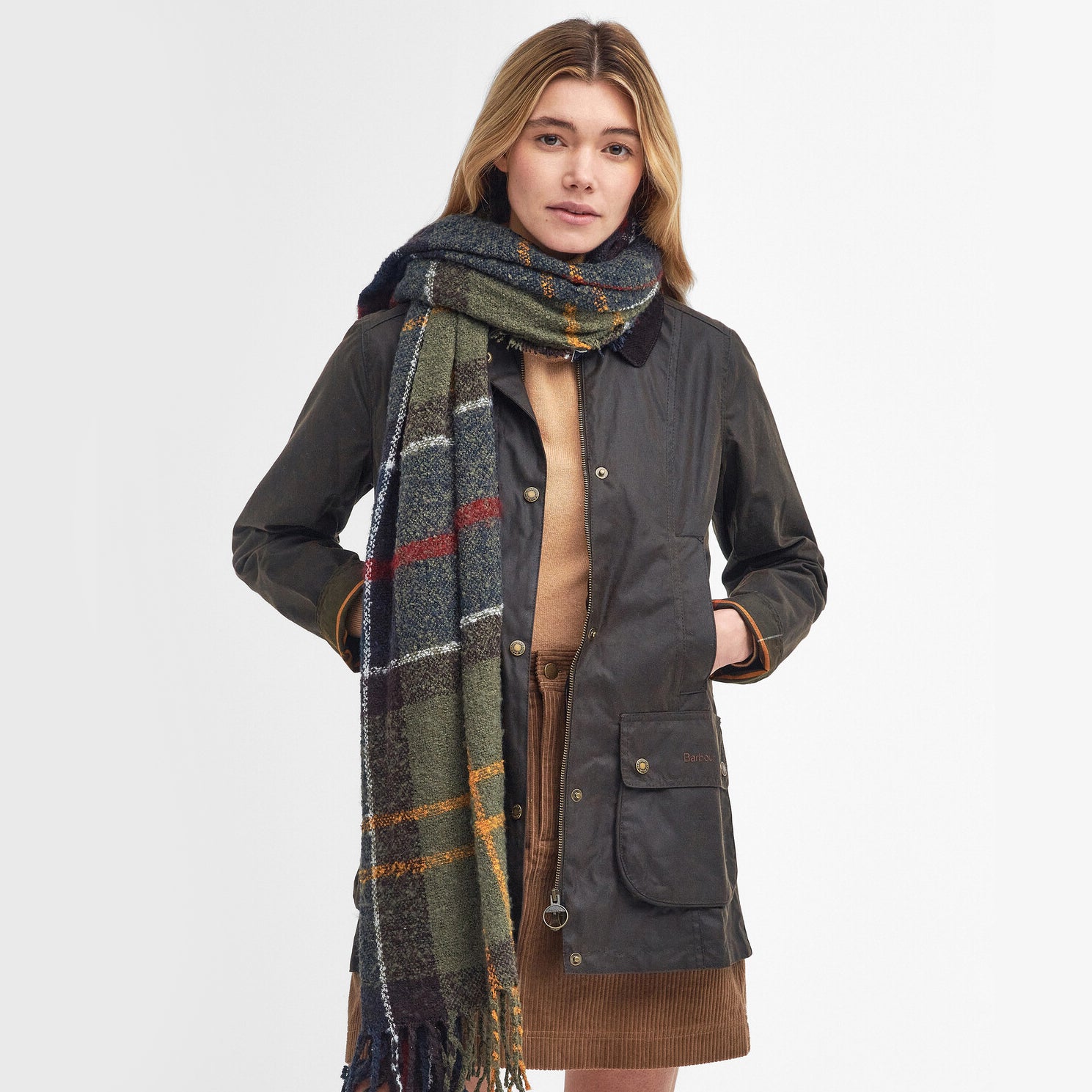 Barbour TARTAN BOUCLE Scarf Womens Classic front view, styled with a jacket, showcasing textured boucle yarn and tasselled hem.