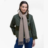 Barbour LAMBSWOOL WOVEN Womens Winter Oatmeal scarf worn front view, showcasing soft lambswool fabric in oatmeal color.