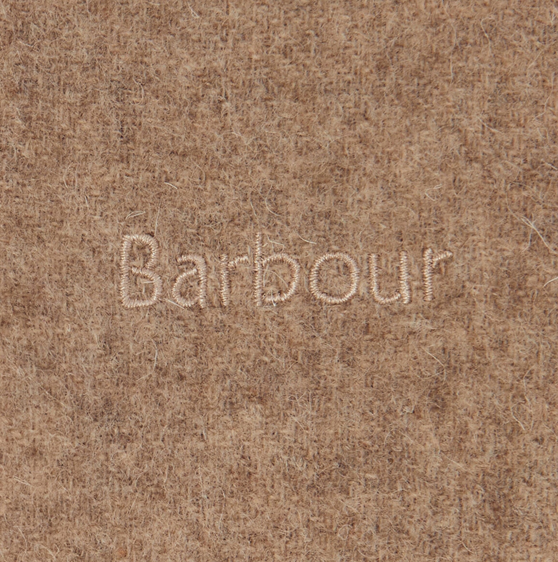 Detail view of the Barbour logo on Barbour LAMBSWOOL WOVEN Womens Winter Oatmeal fabric.