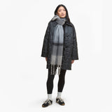 Barbour ISLA TARTAN BOUCLE Womens Winter Monochrome Tartan front view with model wearing dark quilted coat and grey scarf.