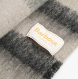Barbour ISLA TARTAN BOUCLE Womens Winter Monochrome Tartan label detail view on soft fabric background.