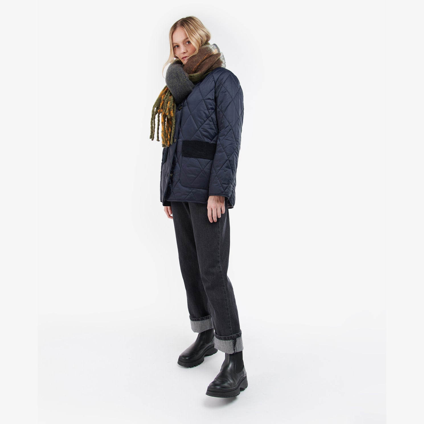 Barbour ISLA TARTAN BOUCLE Scarf Womens Classic side view worn with a quilted jacket, featuring all-over tartan pattern.