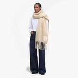 Barbour ELLISON Womens Winter Oatmeal detail view of scarf worn by model with white shirt and dark jeans.