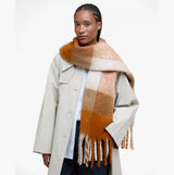 Barbour MARIE Womens Winter Mustard Check detail view of scarf worn by model, showcasing warm hues and soft fabric texture.