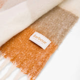 Barbour MARIE Womens Winter Mustard Check detail view of soft scarf showing brand label and color blend.