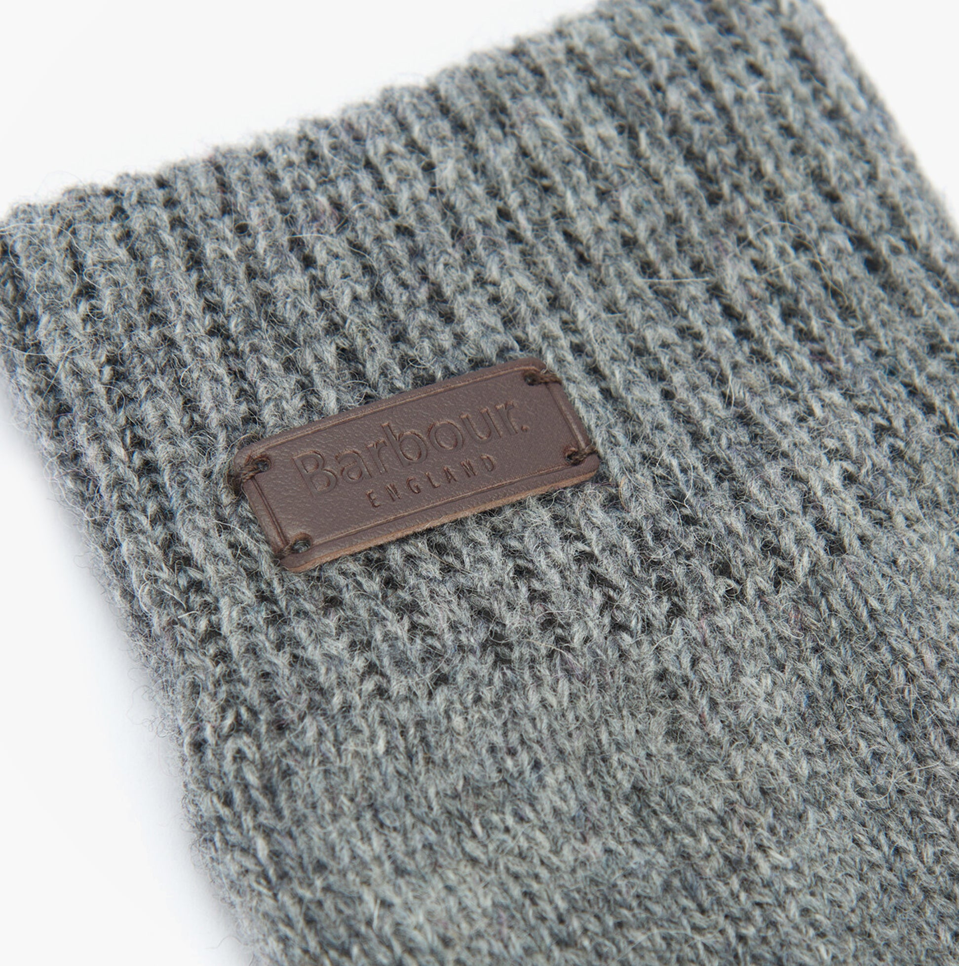 Barbour CARLTON Mens Wool Gloves Grey detail view featuring the logo patch and textured wool fabric.