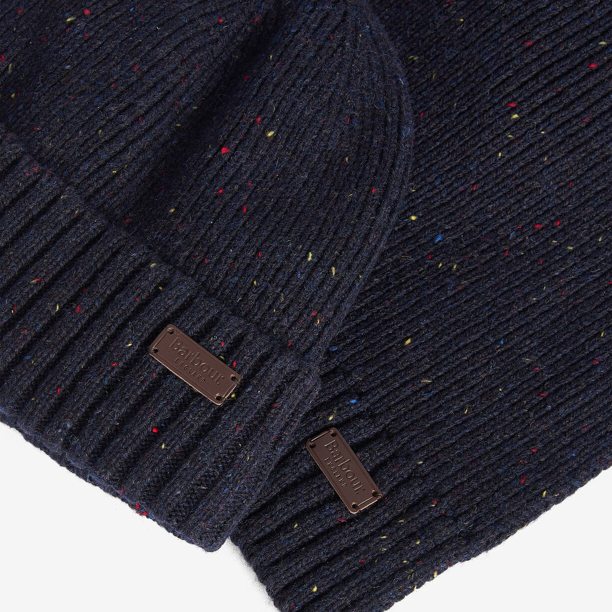 Barbour CARLTON FLECK BEANIE & SCARF Gift Set Mens Navy detail view showcasing ribbed design and labels.