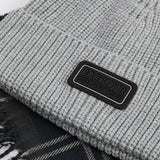 Barbour SWEEPER BEANIE & SCARF Gift Set Mens Grey detail view of ribbed knit beanie and patterned scarf with fringed tassels.