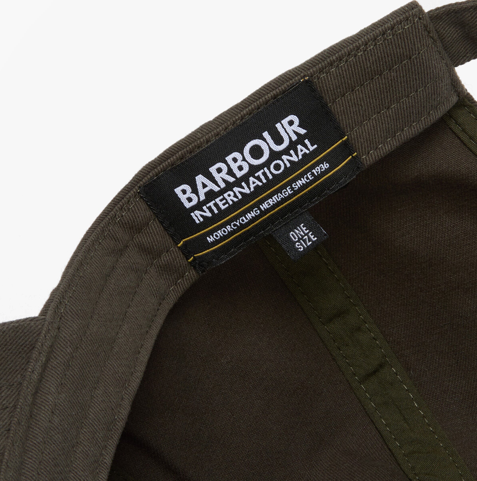 Barbour NORTON Drill Cap Mens Snapback Caps Sage/Shadow inside tag view showcasing brand details and care instructions.