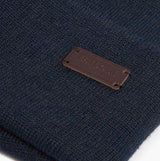 Barbour HEALEY Mens Beanie Navy close-up detail view showing logo on navy knitted fabric.