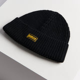 Barbour SWEEPER LEGACY Mens Beanie Black side view showing ribbed texture and silicone logo badge.