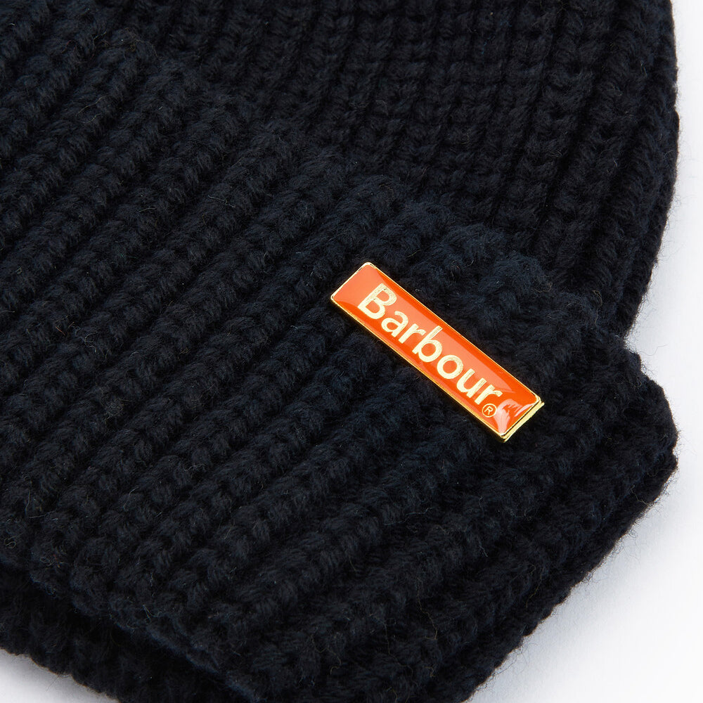 Barbour MOSELY Mens Fisherman Beanie Black close-up view highlighting the removable metal logo pin.