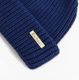 Barbour MOSELY Mens Beanie Inky Blue detail view showcasing woven texture and logo patch.