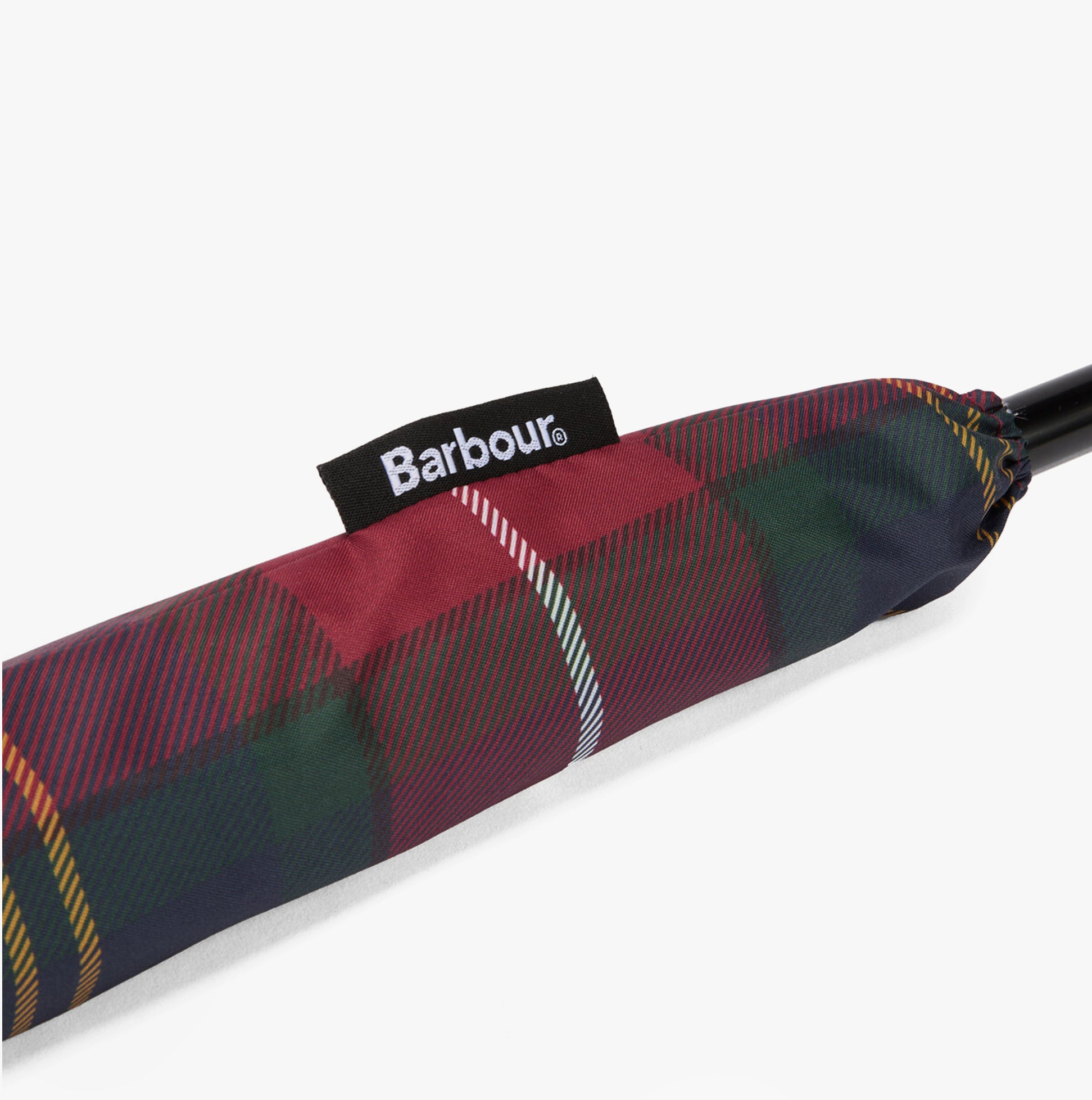 Barbour Tartan Walker Umbrella detail view with woven Barbour side flag label on the canopy sleeve.