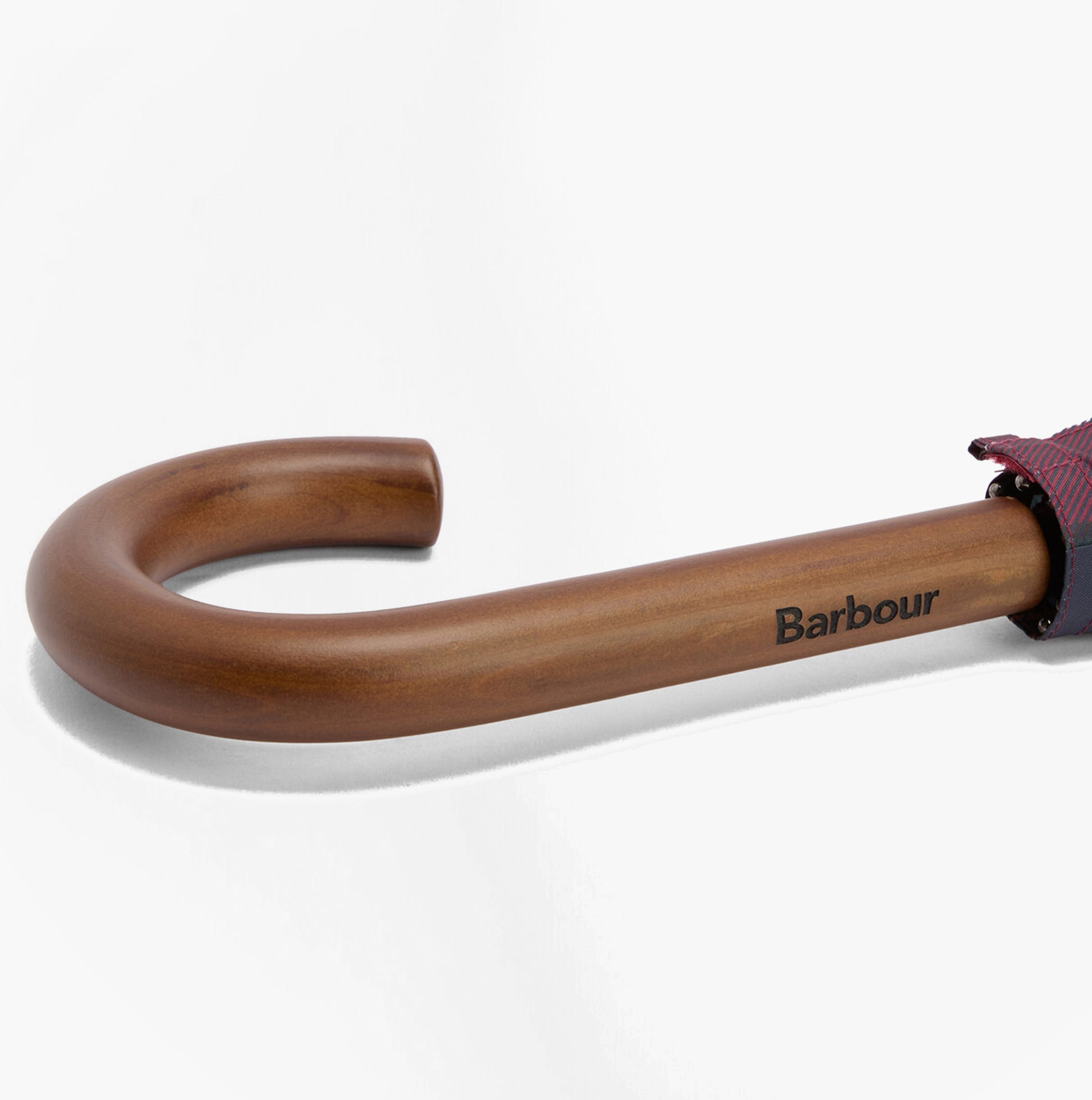 Barbour Tartan Walker Umbrella detail view of the wooden handle with Barbour logo, showcasing craftsmanship.