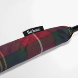 Barbour Tartan Walker Umbrella detail view of the canopy sleeve showing tartan design and Barbour label.