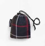 Barbour Mens TARTAN SHOWERPROOF PONCHO Classic Tartan packed in a drawstring bag, top view showing tartan pattern.