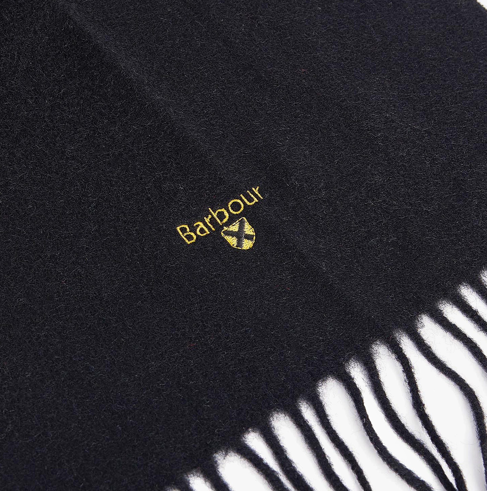 Barbour PLAIN LAMBSWOOL Mens Winter Black detail view of black lambswool scarf with logo.