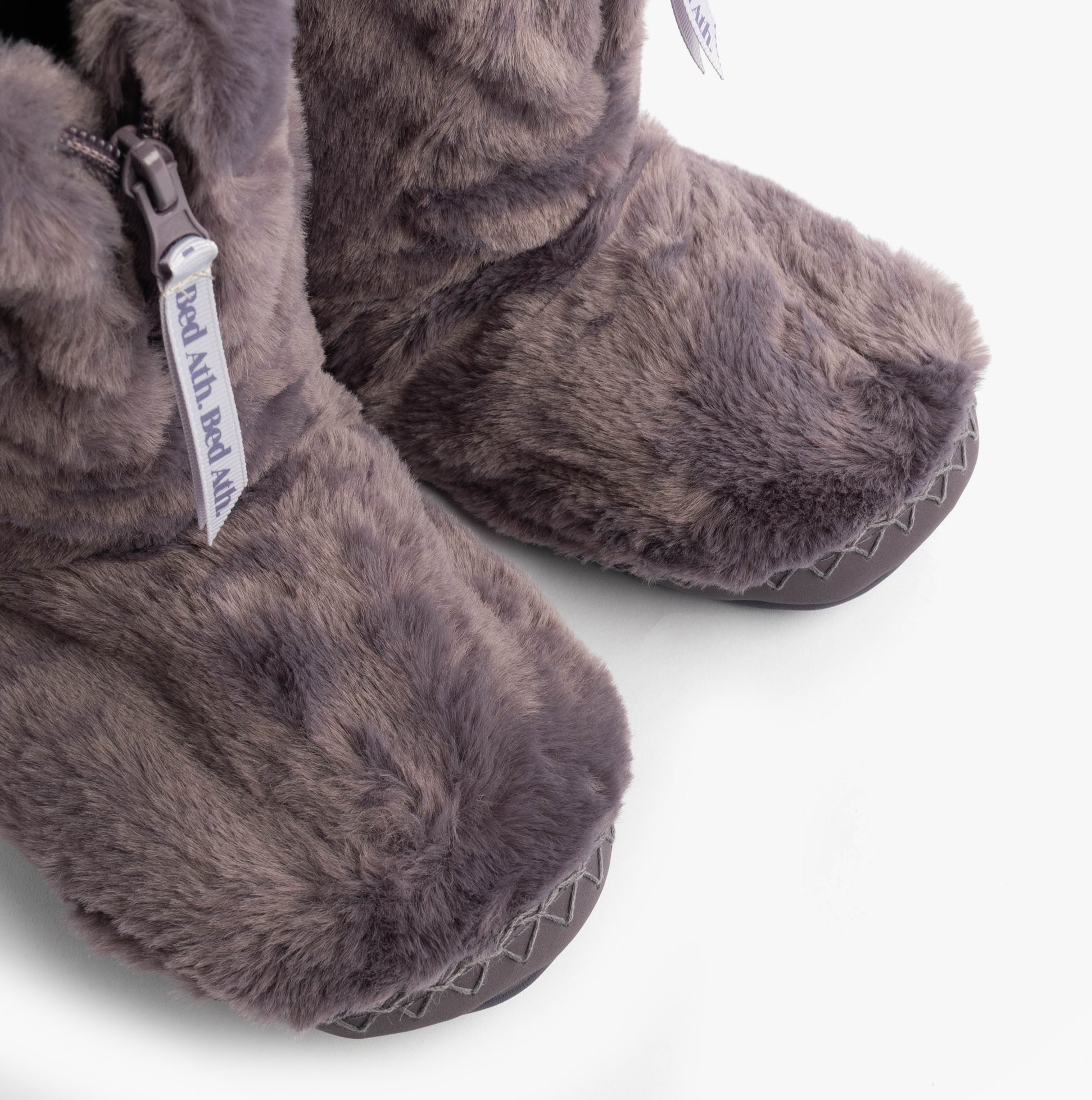 Bedroom Athletics MARILYN Womens Slipper Boots Frosted Grape detail view showcasing faux fur upper and synthetic sole.