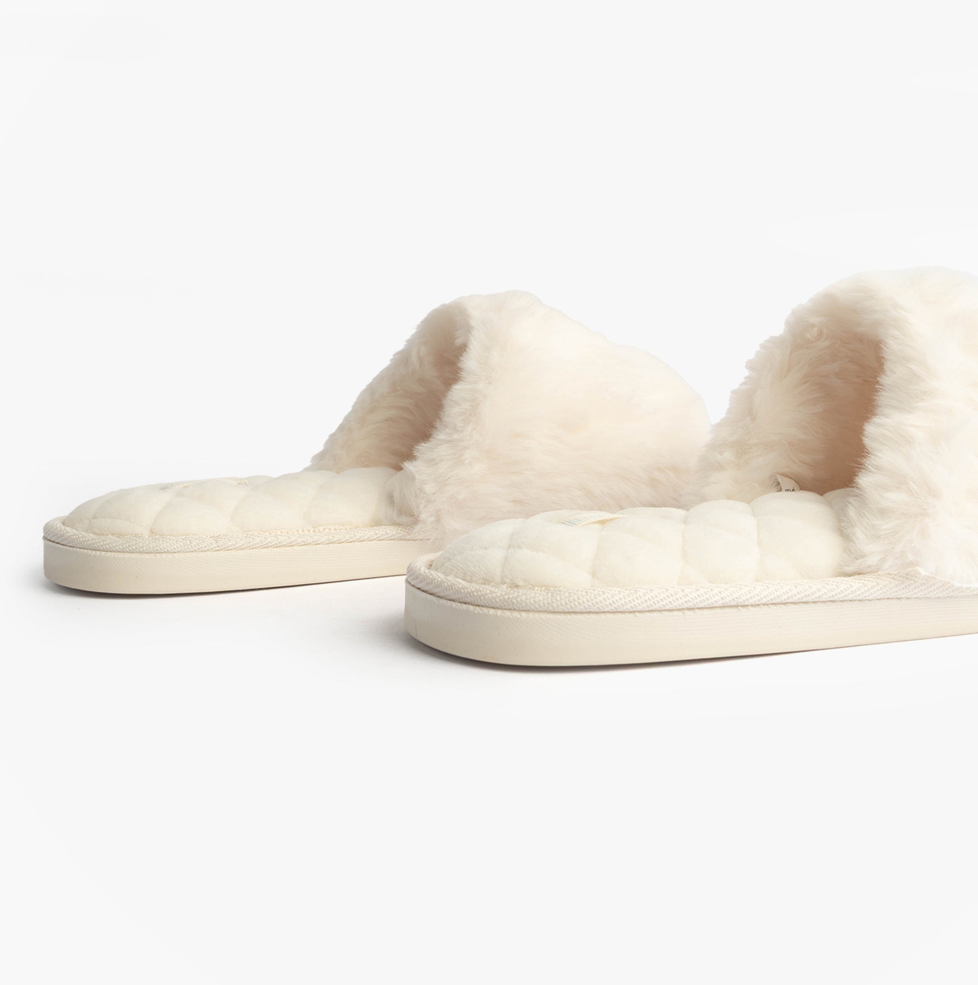 Bedroom Athletics ERIN Womens Slipper Sliders Cream side view, showing faux fur upper and rubber sole.