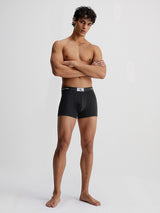 Calvin Klein CK96 3 Pack Mens Trunks Black front view on model, highlighting medium-rise waist and CK signature waistband.