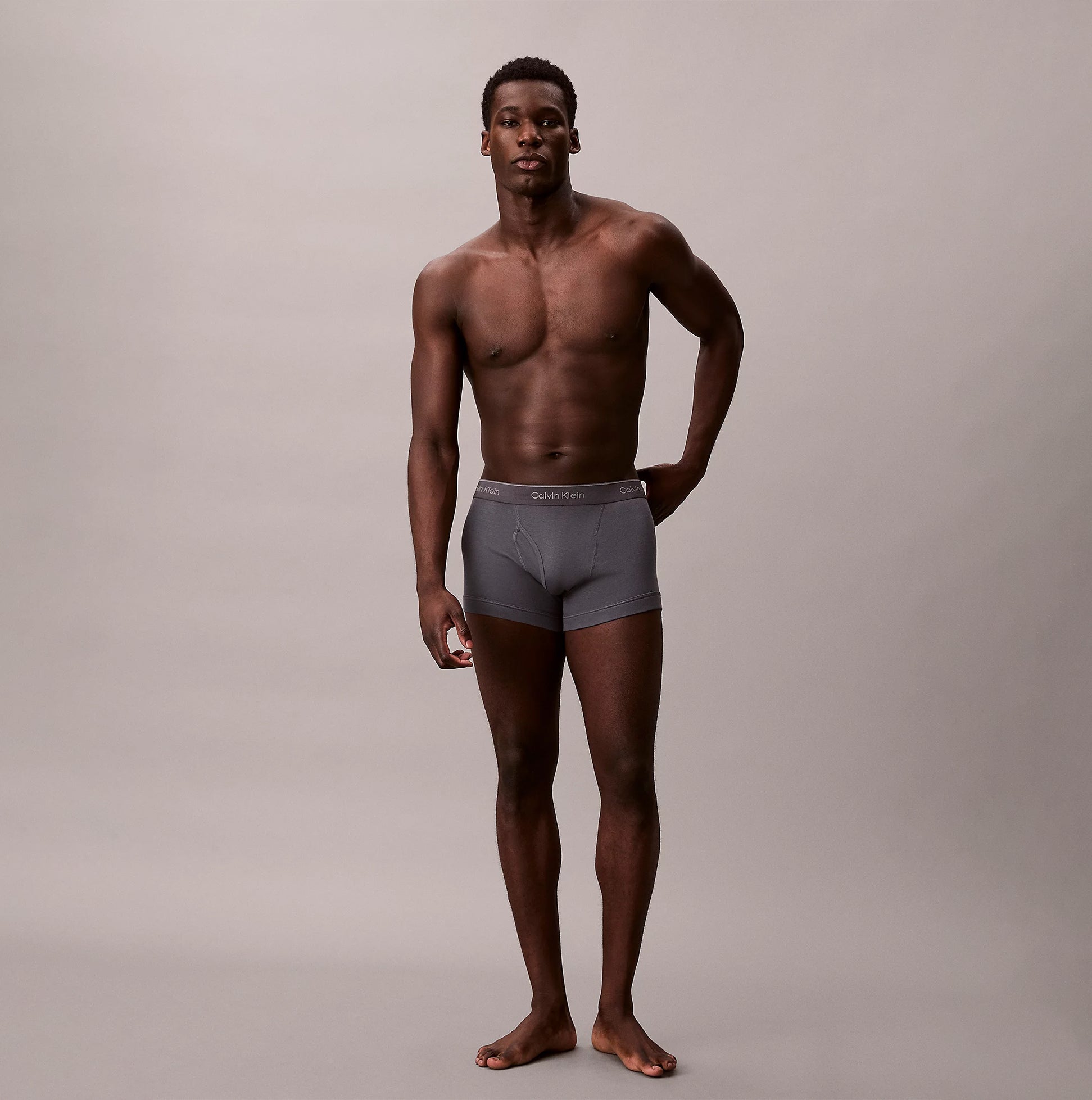Calvin Klein TRUNK 3 Pack Mens Cotton Classics Multicoloured front view of model wearing grey trunk underwear.