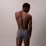 Calvin Klein TRUNK 3 Pack Mens Cotton Classics Multicoloured, back view of model wearing gray trunks.