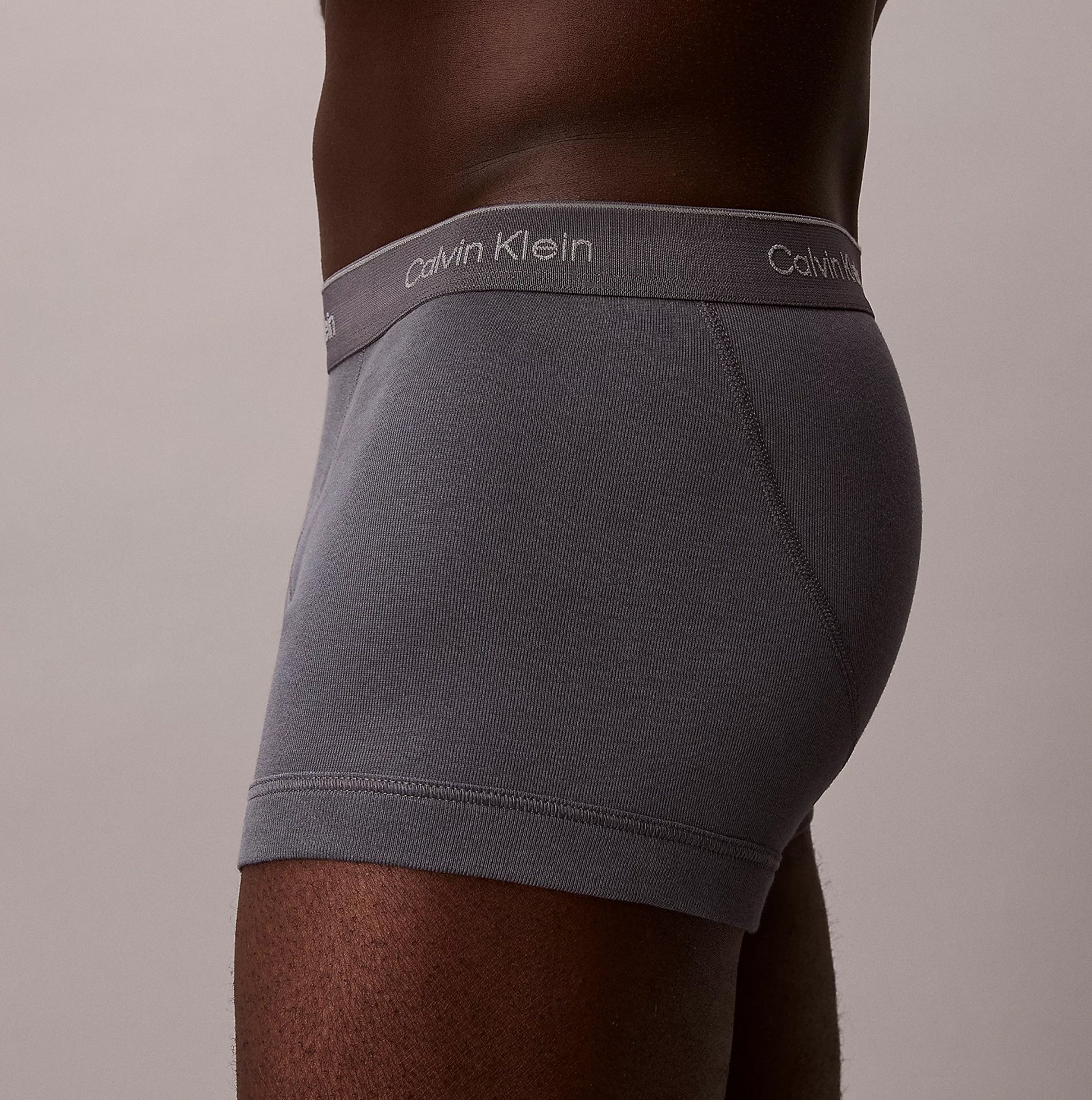 Calvin Klein TRUNK 3 Pack Mens Cotton Classics Multicoloured side view of grey trunk with logo waistband.