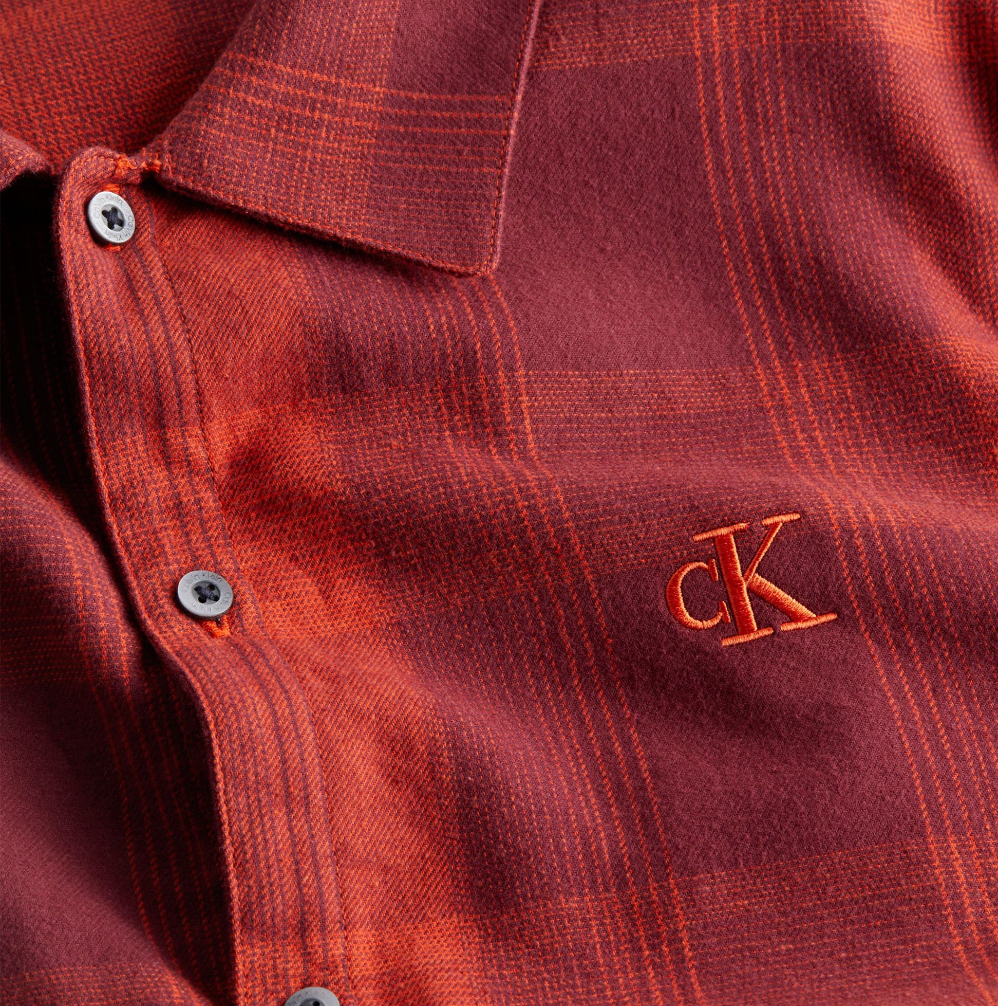 Calvin Klein FLANNEL Mens Pyjama Set Red detail view showcasing soft cotton flannel fabric and CK embroidery.