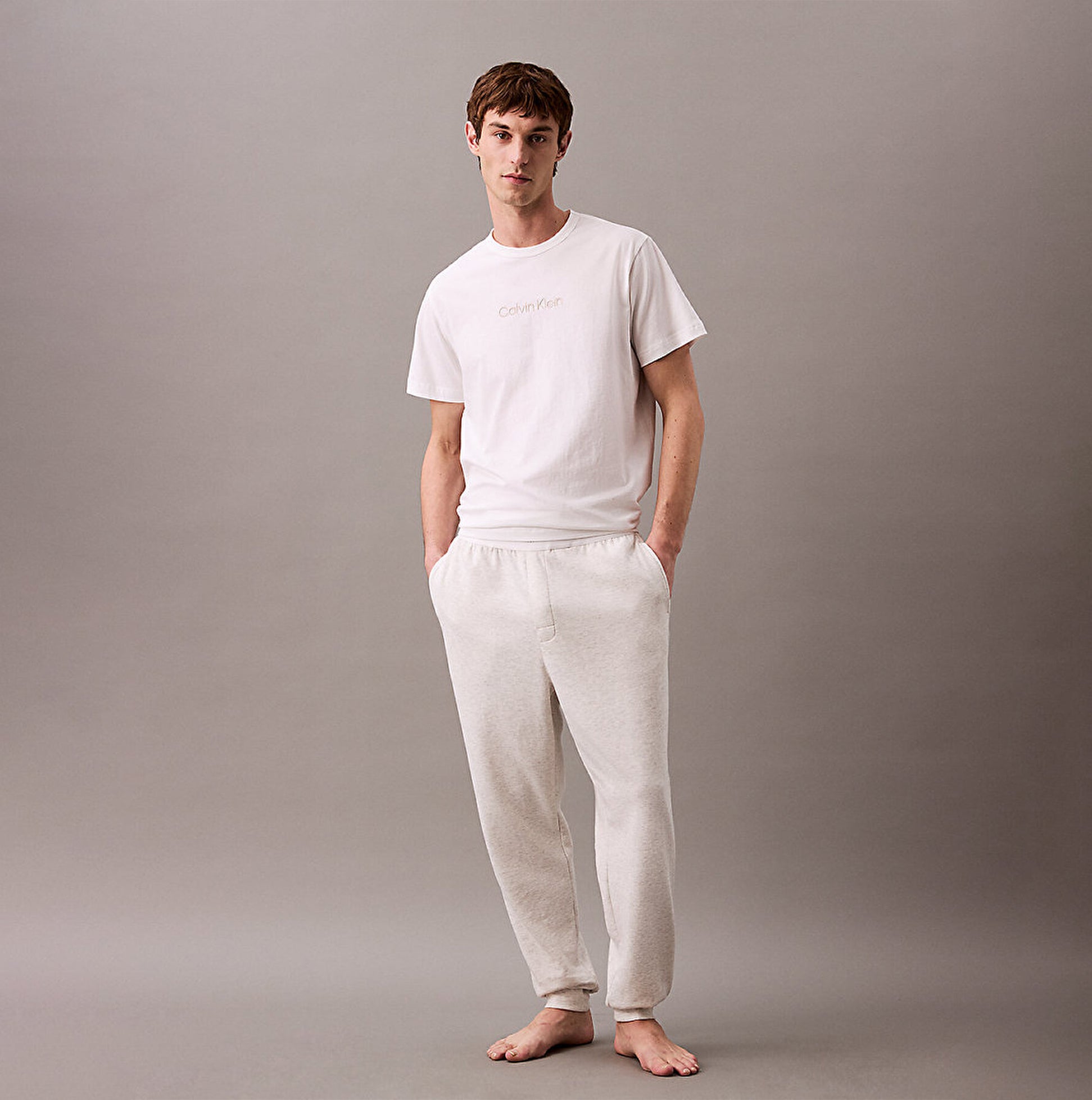 Calvin Klein ICON COTTON TERRY Mens Lounge Joggers Grey Heather front view with model, showcasing comfort and style.