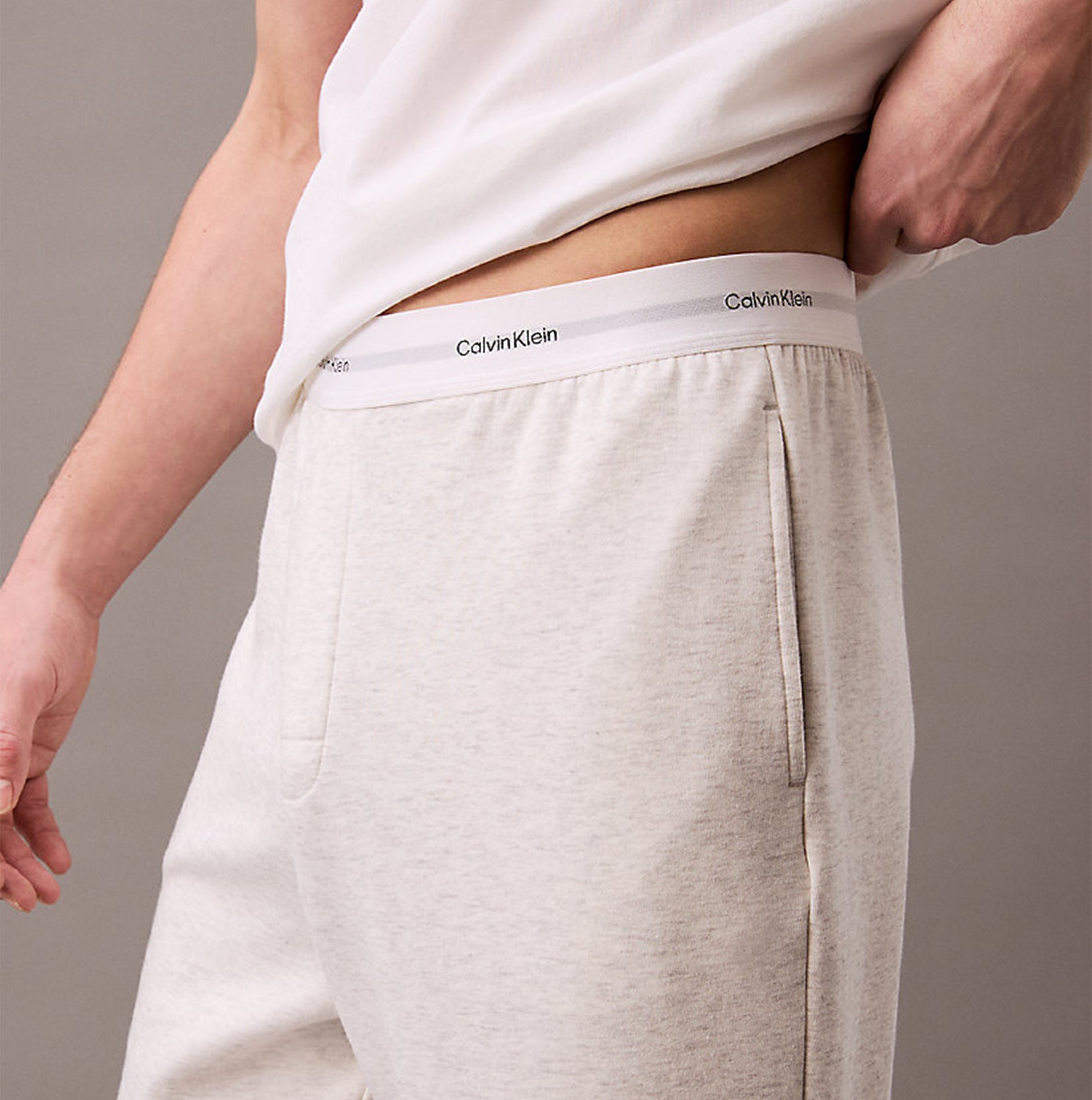 Calvin Klein ICON COTTON TERRY Mens Lounge Joggers Grey Heather side view showing CK signature elastic waistband and side seam pockets.