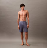 Calvin Klein SLEEP SHORT Mens Grisaille side view on model, showcasing breathable material and CK signature elastic waistband.