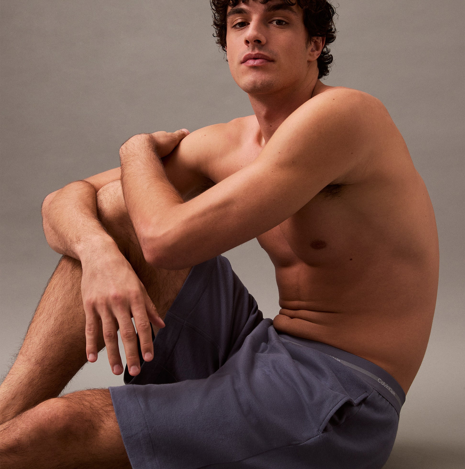 Calvin Klein SLEEP SHORT Mens Grisaille side view on model showing comfort and fit with side seam pockets.