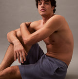 Calvin Klein SLEEP SHORT Mens Grisaille side view on model showing comfort and fit with side seam pockets.