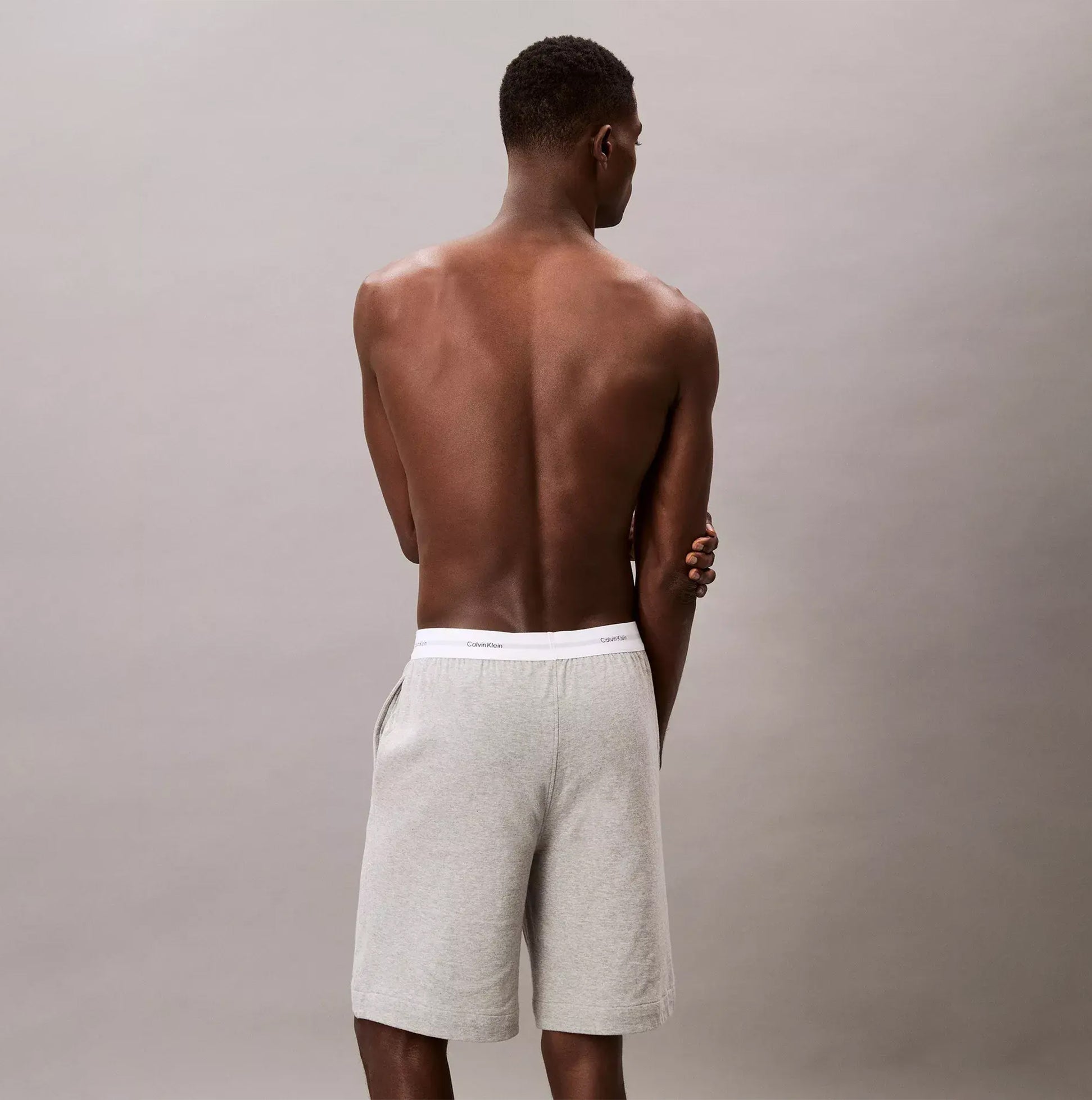 Calvin Klein SLEEP SHORT Mens Medium Grey Heather back view showing side seam pockets and CK signature waistband.