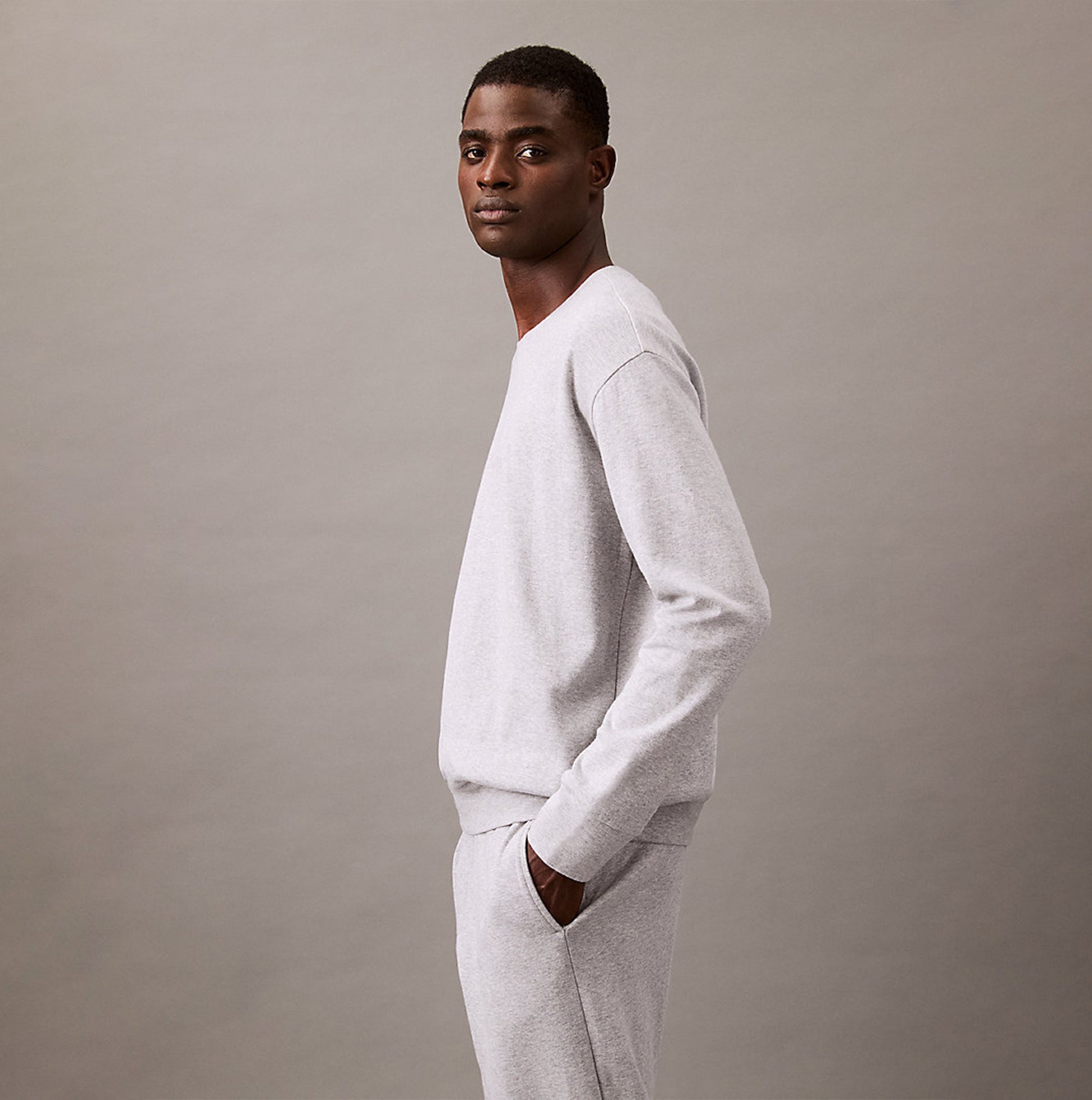 Calvin Klein ICON COTTON TERRY Mens Sweatshirt Medium Grey Heather side view showcasing crew neckline and rib-knit details.