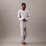 Calvin Klein ICON COTTON TERRY Mens Sweatshirt Medium Grey Heather front view on model, showcasing crew neckline and rib-knit details.