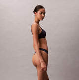 Calvin Klein Womens Invisible 3 Pack Thong Multi side view model wearing dark thong underwear