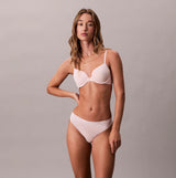 Calvin Klein Womens Invisible 3 Pack Thong Multi front view on model, showcasing stylish design and fit.