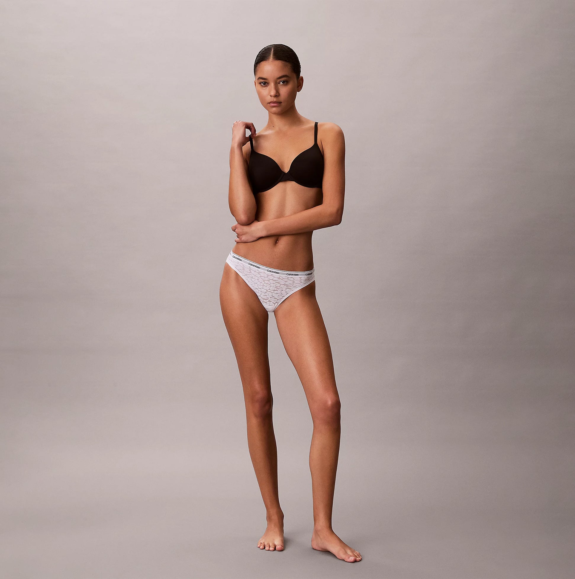 Calvin Klein BIKINI 3 PACK Womens Bikini Multicoloured side view model wearing brown bra and white bikini.