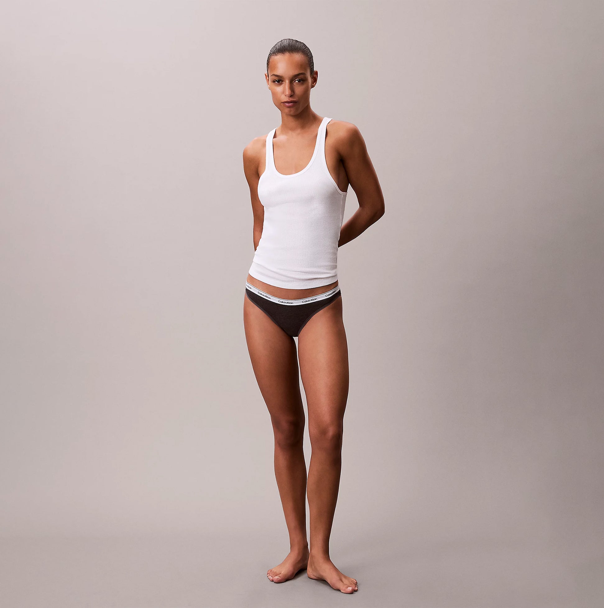 Calvin Klein 000QD5207E BIKINI 3 PACK Womens Briefs Multicoloured front view model wearing brown bikini and white tank top
