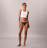 Calvin Klein THONG 3 PACK Womens Thong Multicoloured front view model wearing grey thong and white crop top.