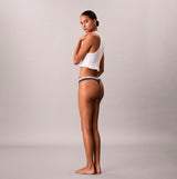 Calvin Klein THONG 3 PACK Womens Thong Multicoloured side view model wearing thong and tank top.
