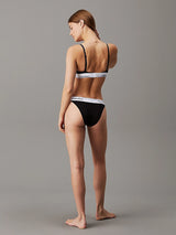 Calvin Klein MODERN COTTON Unlined Womens Triangle Bra Black back view showcasing adjustable straps and elastic underband.