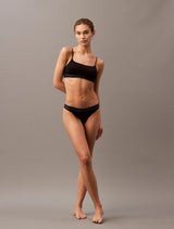 Calvin Klein TONAL LOGO COTTON Womens Bralette Black front view on model with matching underwear