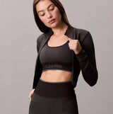 Calvin Klein Medium Impact Womens Sports Bra Black front view worn with matching jacket and high-waisted leggings
